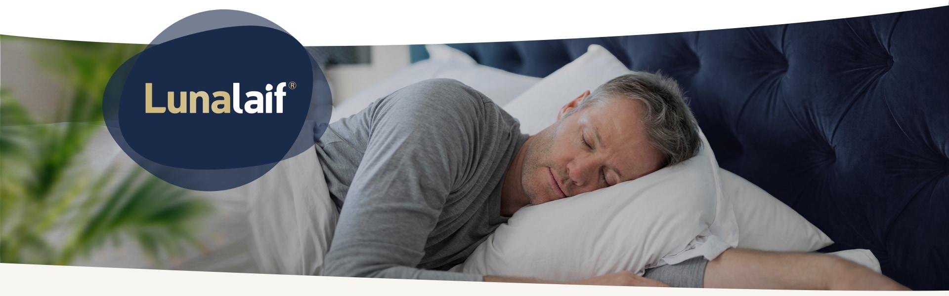 elderly man lying in bed